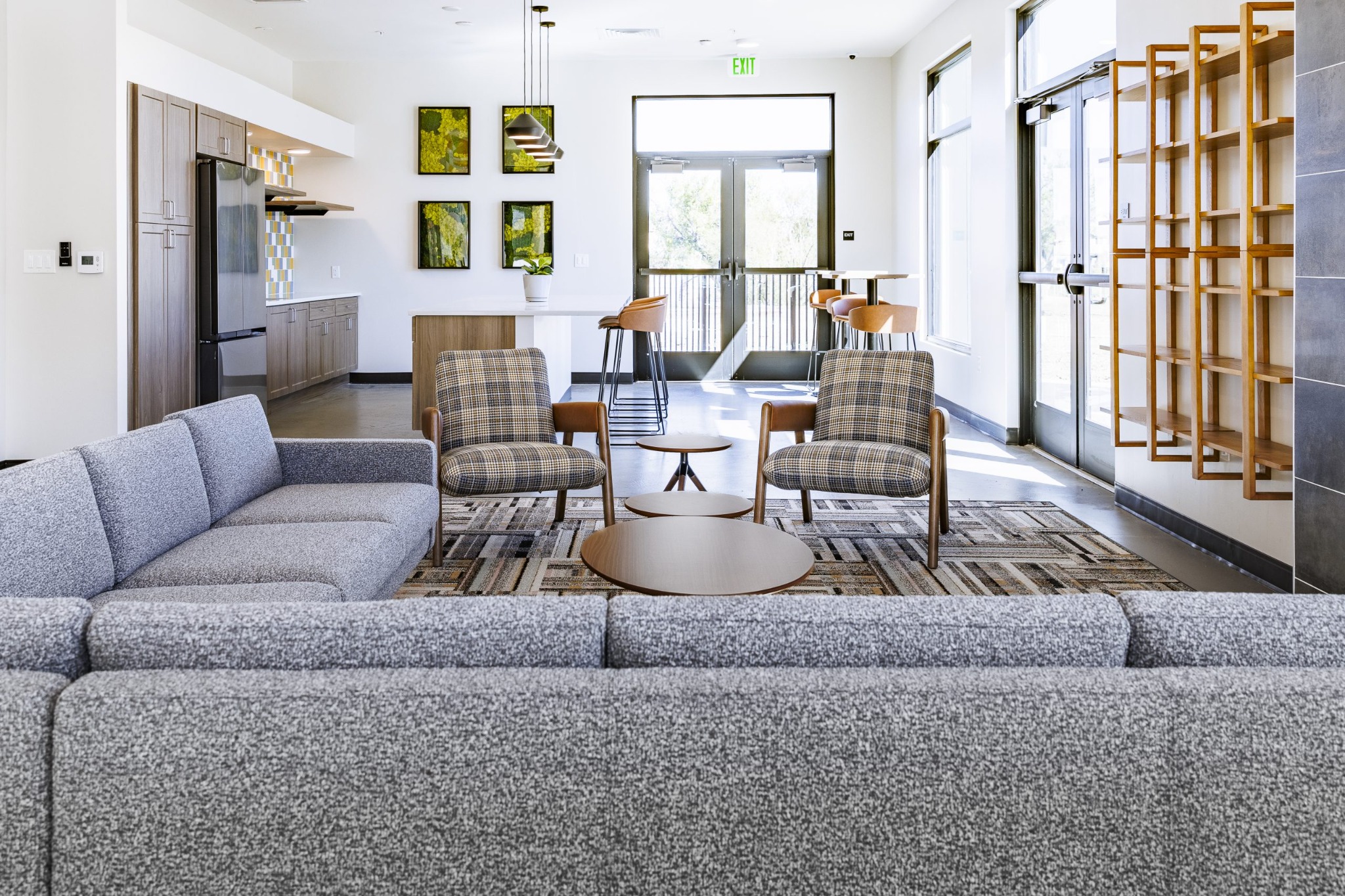 Shared lounge seating and community kitchenette