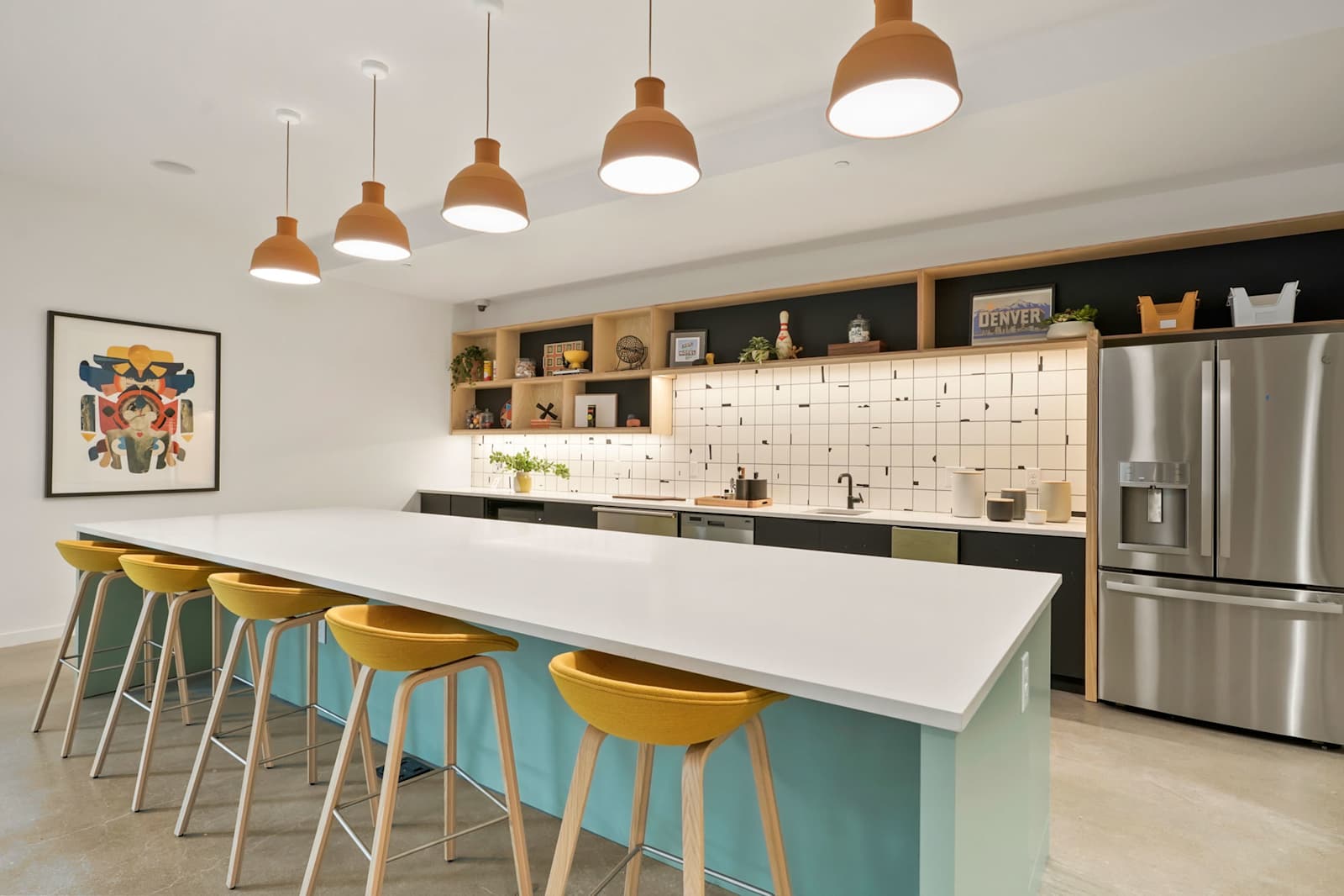 Shared kitchen with a large island and colorful bar seating